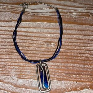 Chico’s Silver Tone pendant on Multi Cord.